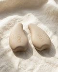The MamaWarm pair on soft cream linen, sold as a pair.